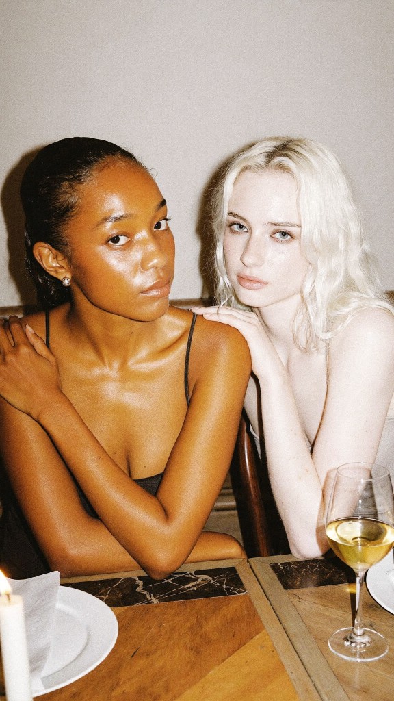 Two friends at a candlelit dinner